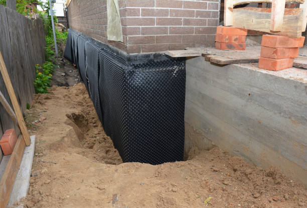 SJ Waterproofing Pros technician performing targeted Vapor Barrier Installation assessment in Perrinton, MI